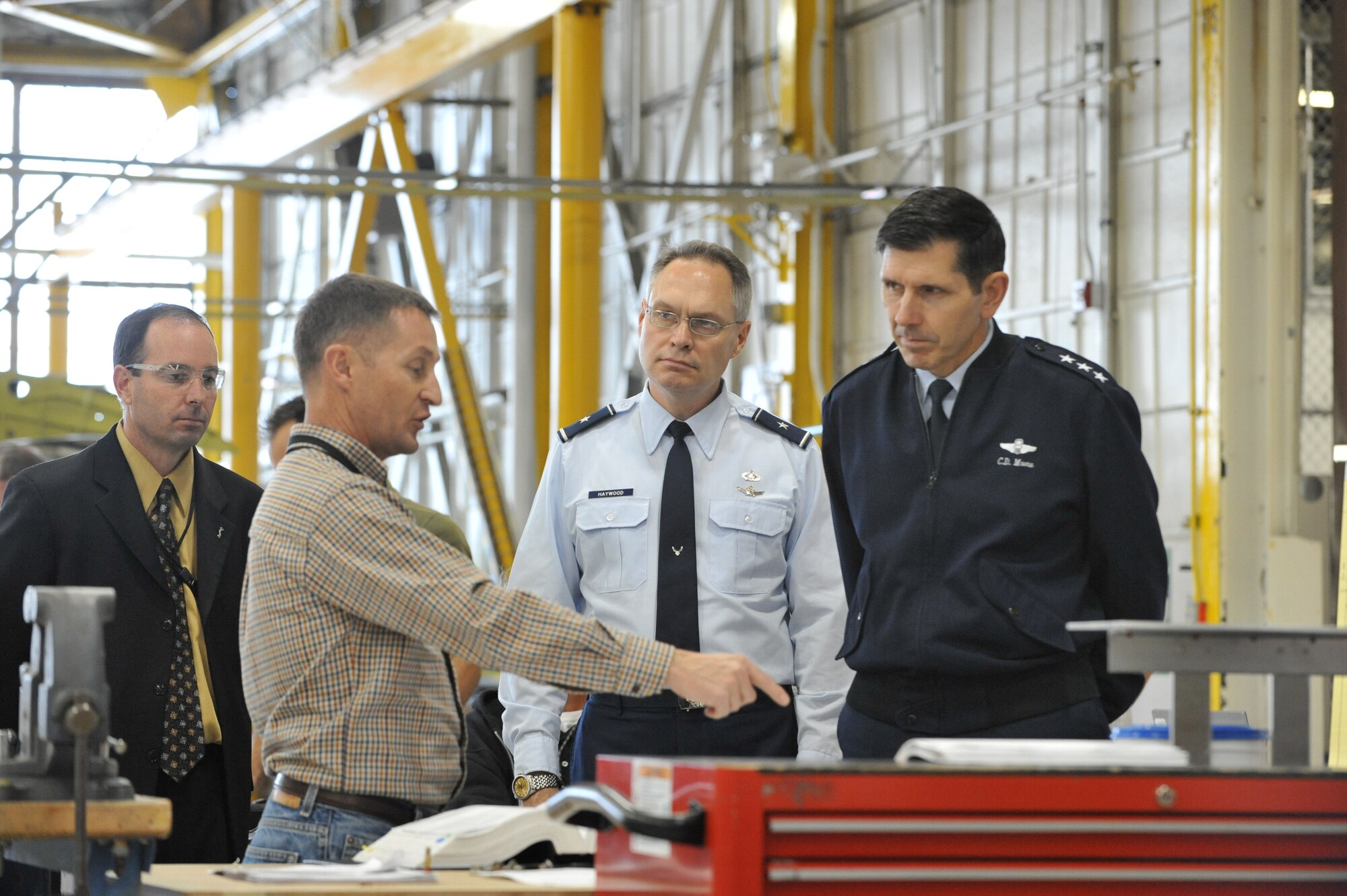 Lt. Gen. C.D. Moore II, Air Force Materiel Command vice commander; and Brig.
Gen. James Haywood,  AFMC Director of Strategic Plans, Programs, Analyses,
Assessments and Lessons Learned; visited Hill Air Force Base, Utah, on Oct.
24. The two generals are acquainting themselves with Hill and other AFMC
bases, following their new assignments to the command.  At Ogden Air
Logistics Center, they were briefed about production and improvements Ogden
Air Logistics Center has completed on the A-10,  C-130, F-16, and F-22
aircraft; ICBM missiles; and components for most of the other combatant
commanders' weapons systems. Here, Steve Zaiser, 309th Maintenance Wing engineer, isconducting the briefing. Looking on (far left) is Rick Buhl, 309th
Commodities Maintenance Group Civilian Leader.
