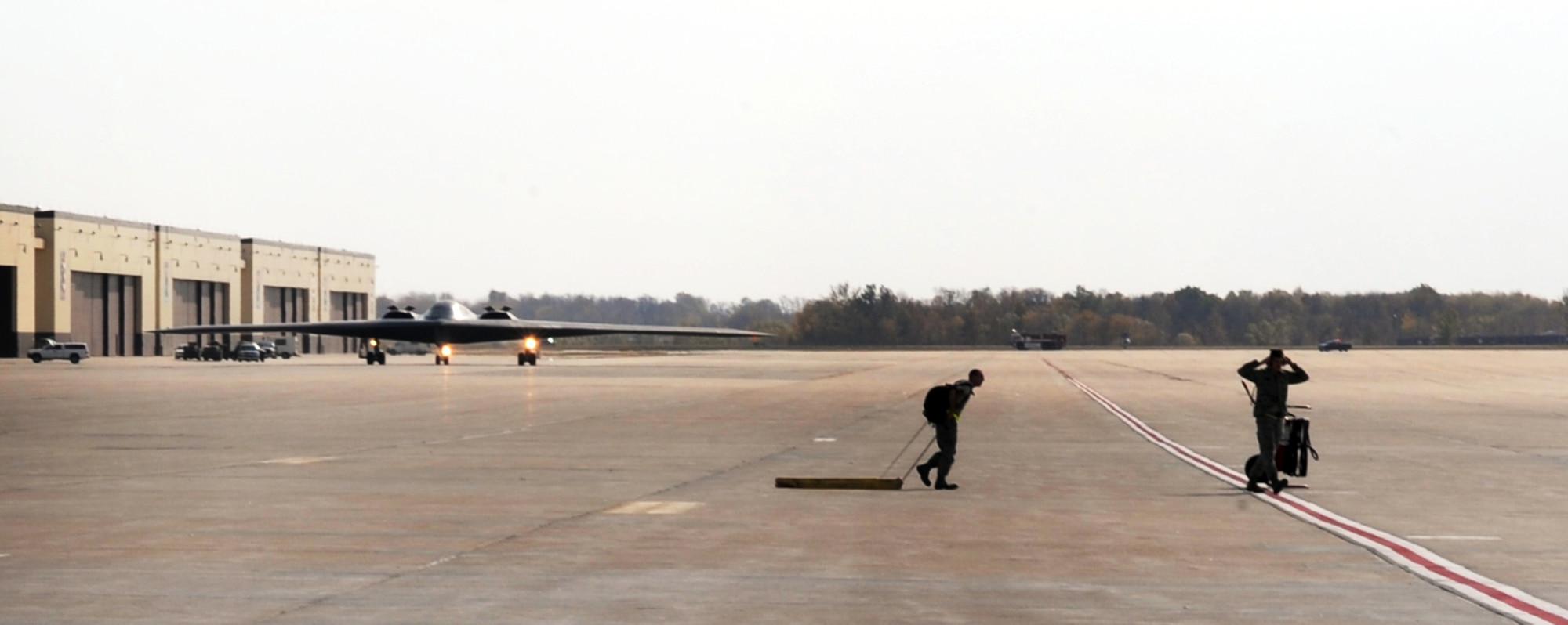 WHITEMAN AIR FORCE BASE, Mo --509th Aircraft Maintenance Squadron, maintainers and crew chiefs, prepare to receive a B-2 Stealth Bomber during Global Thunder 12 exercise Oct. 25.  The exercise provides unique training opportunities for component, task force, unit forces, and command posts to deter, and if necessary defeat a military attack against the United States and to employ forces as directed by the president. (U.S. Air Force photo/Senior Airman Laura Goodgame) 