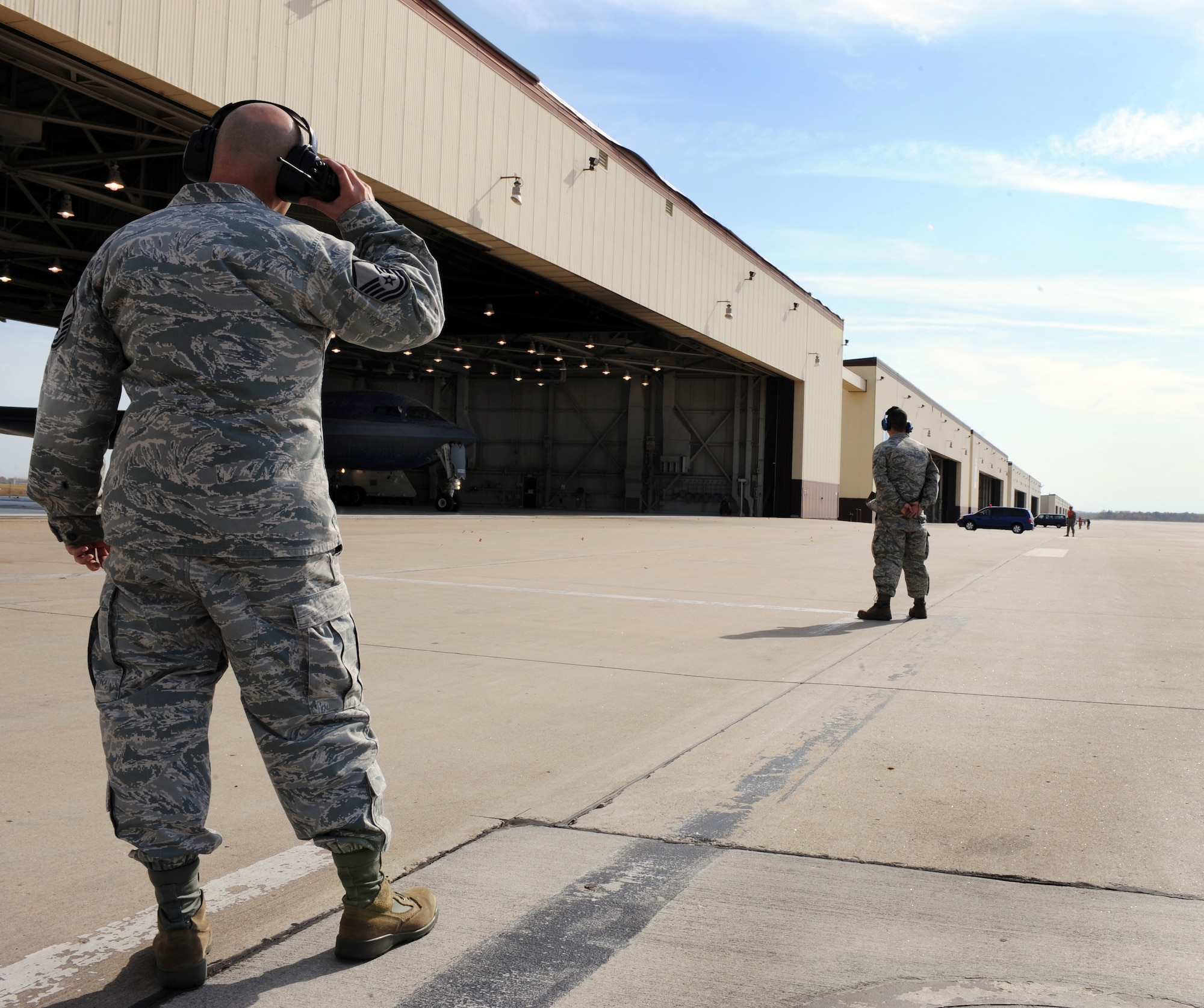 WHITEMAN AIR FORCE BASE, Mo -- Master Sgt. Stewart Reiter listens to radio chatter while supervising the 509th Aircraft Maintenance Squadron, maintainers and crew chiefs, while they prepare B-2 Stealth Bombers for Global Thunder 12 exercise Oct. 25.  The exercise provides unique training opportunities for component, task force, unit forces, and command posts to deter, and if necessary defeat a military attack against the United States and to employ forces as directed by the president. Sergeant Reiter is assigned to the 509th AMXS and is a specialist section supervisor. (U.S. Air Force photo/Senior Airman Laura Goodgame) 