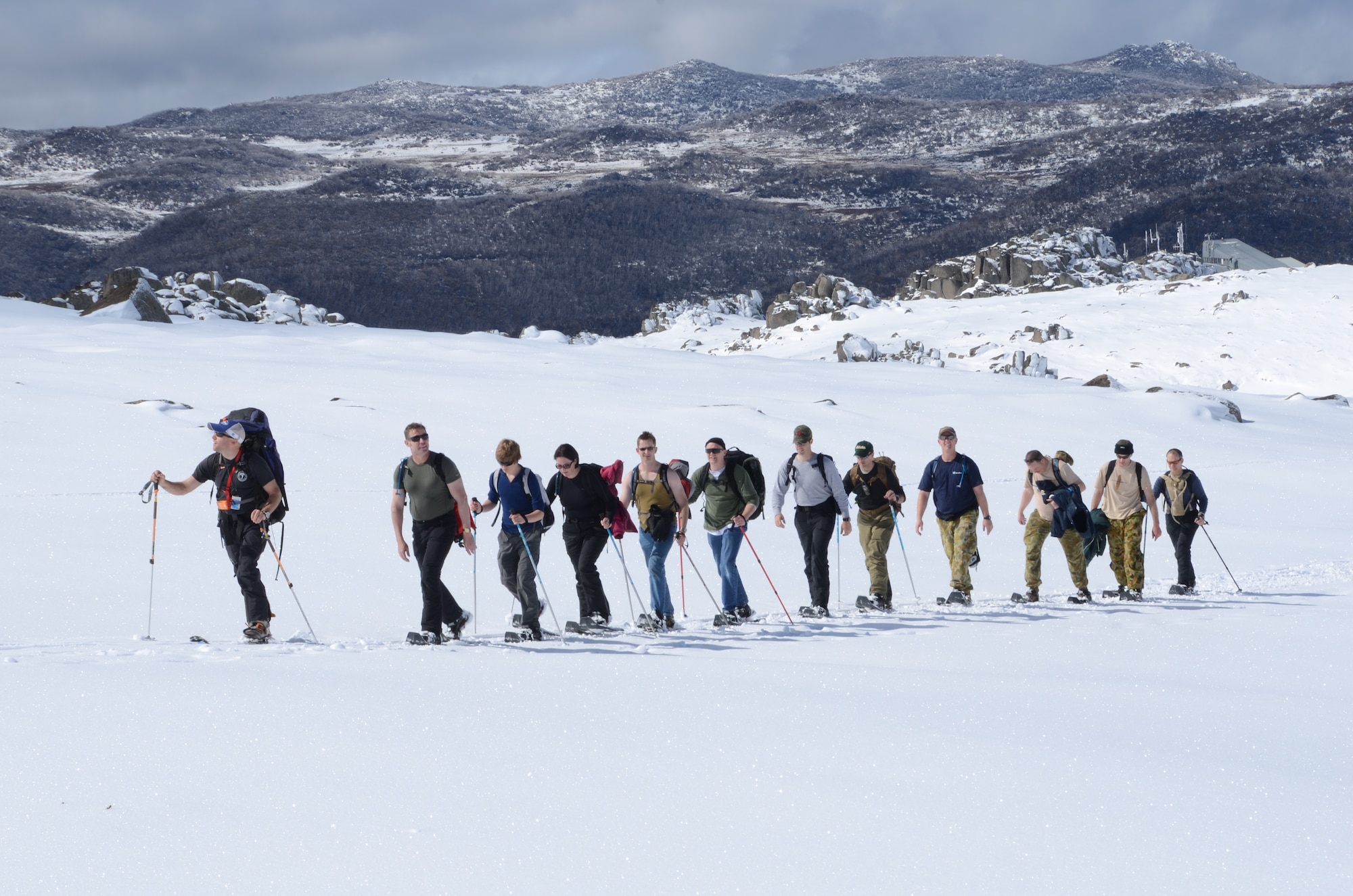 American and Australian service members trek across a snowy landscape while scaling Mount Kosciuszko in New South Wales, Australia, Oct. 3, 2011. The expedition marked the first multi-national team to complete one of the peaks of the Seven Summits Challenge. (Courtesy photo)