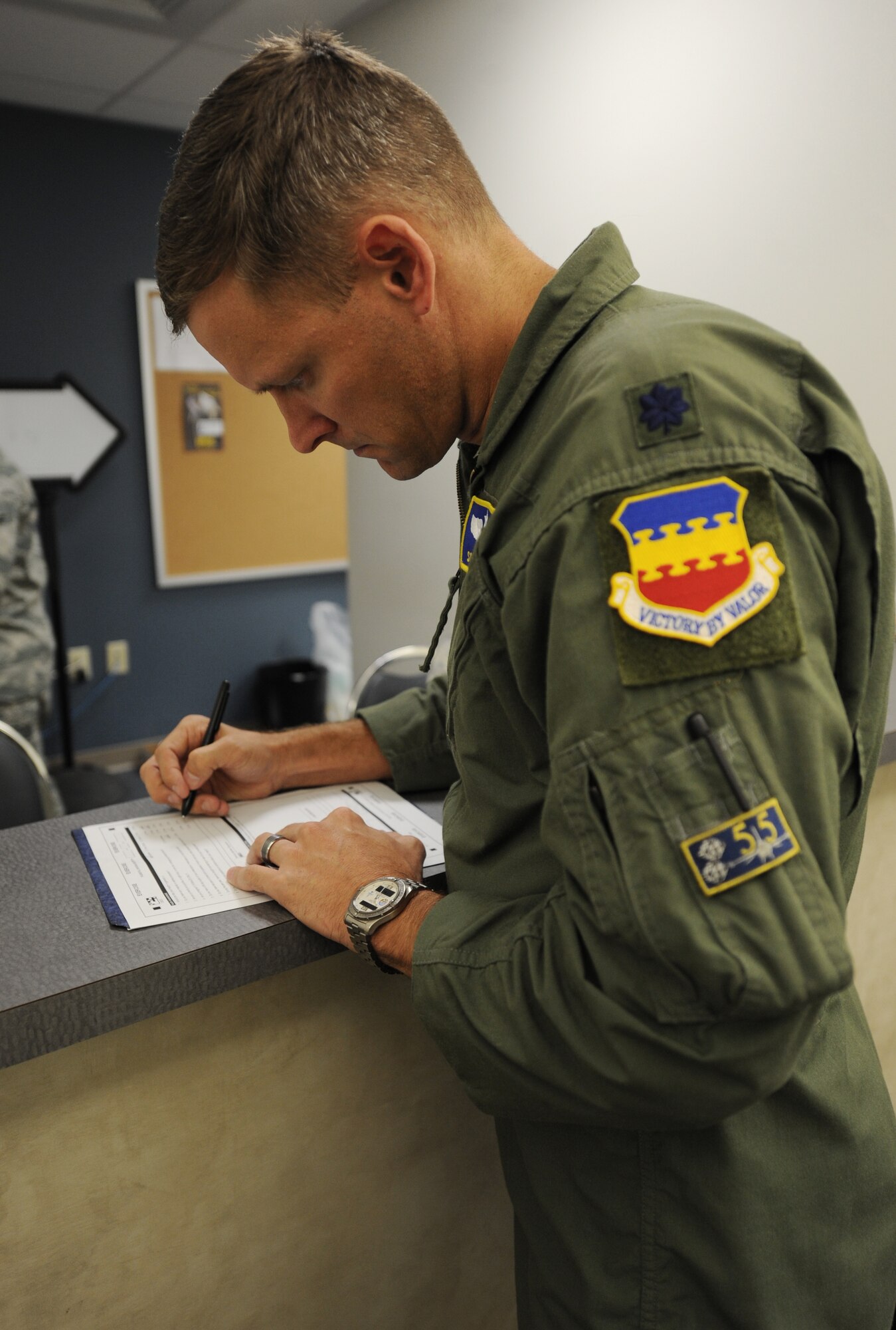 An F-16 Fighting Falcon pilot processes through the line at the Deployment Processing Center at Shaw Air Force Base, S.C., Oct. 26, 2011. This week the Phase I exercise Sea Lion 12-01 kicked off giving Shaw Airmen the opportunity to train and simulate the process before deploying. (U.S. Air Force photo by Airman 1st Class Tabatha Duarte/Released)