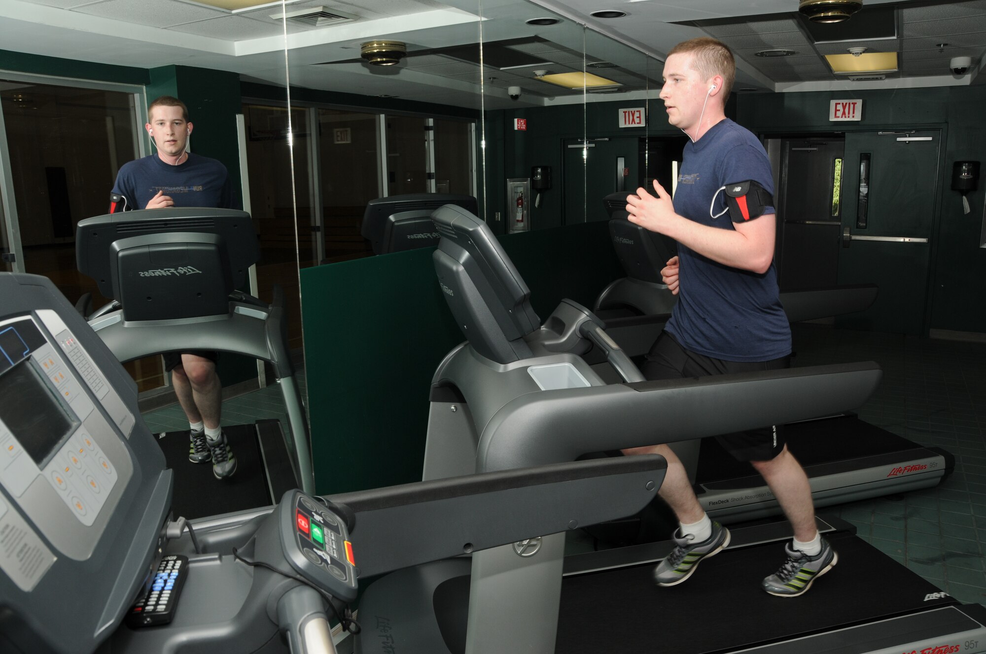 Airman 1st Class Jacob Burns, 335th Training Squadron, runs on a treadmill at the Dragon Fitness Center Oct. 20, 2011, Keesler Air Force Base, Miss.  The primary goal of Keesler’s fitness services is to assist all customers in improving their overall fitness level and quality of life.  (U.S. Air Force photo by Kemberly Groue)