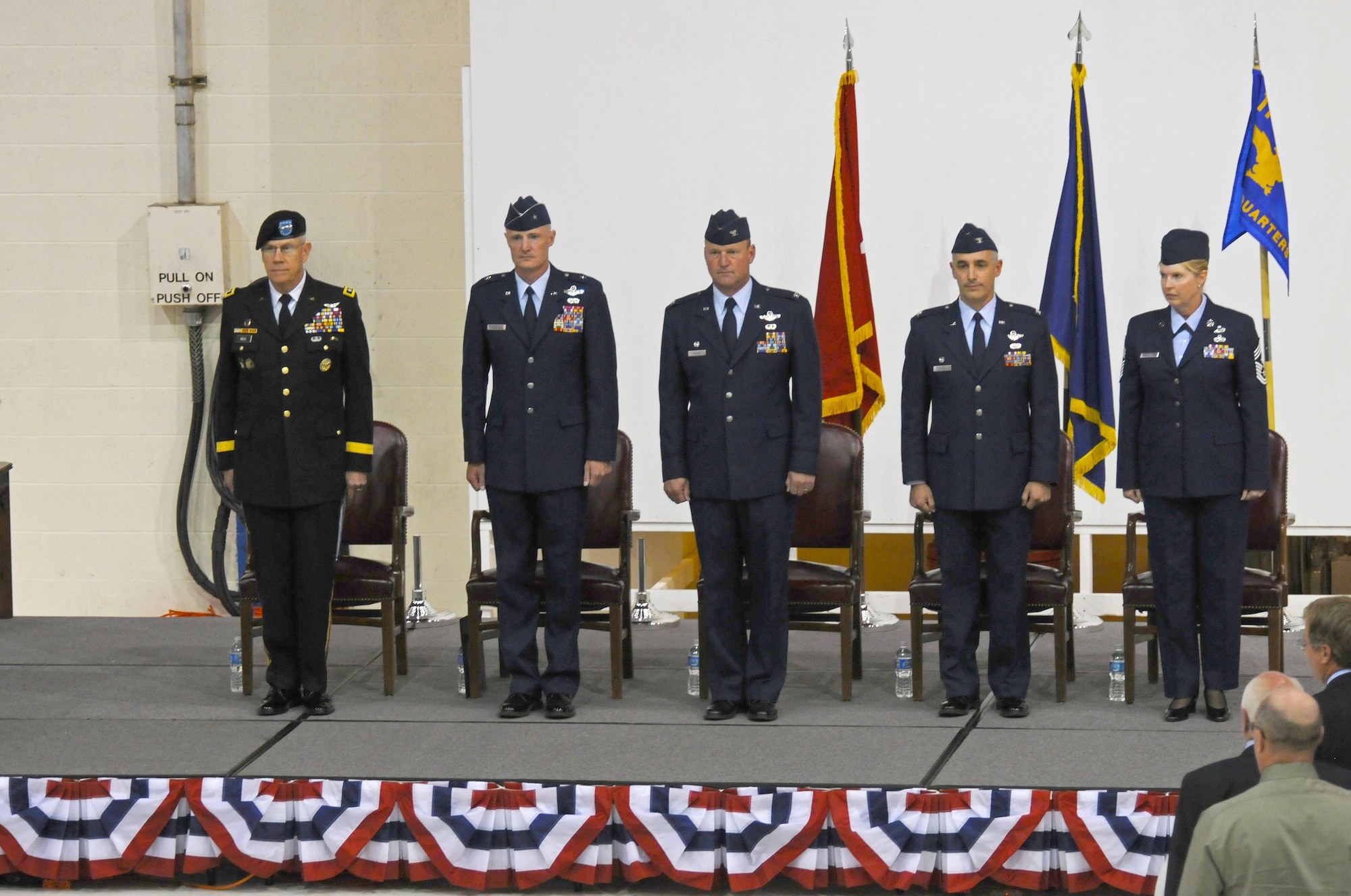 Col. Jeffrey Silver (right of center) stands ready to assume command of the 173rd Fighter Wing during a change of command ceremony Sept. 11, 2011. Brig. Gen. Steven D. Gregg (left of center), commander of the Oregon Air National Guard officiated the passing of the wing guidon to Silver after Col. James Miller (center), the outgoing commander relinquished it. Maj. Gen. Raymond F. Rees, The Adjutant General, Oregon stands at the far left. Silver joined the wing in June from the 142nd Fighter Wing in Portland, as the vice commander. (U.S. National Guard photo by Amn. Basic Penny Hamilton) RELEASED