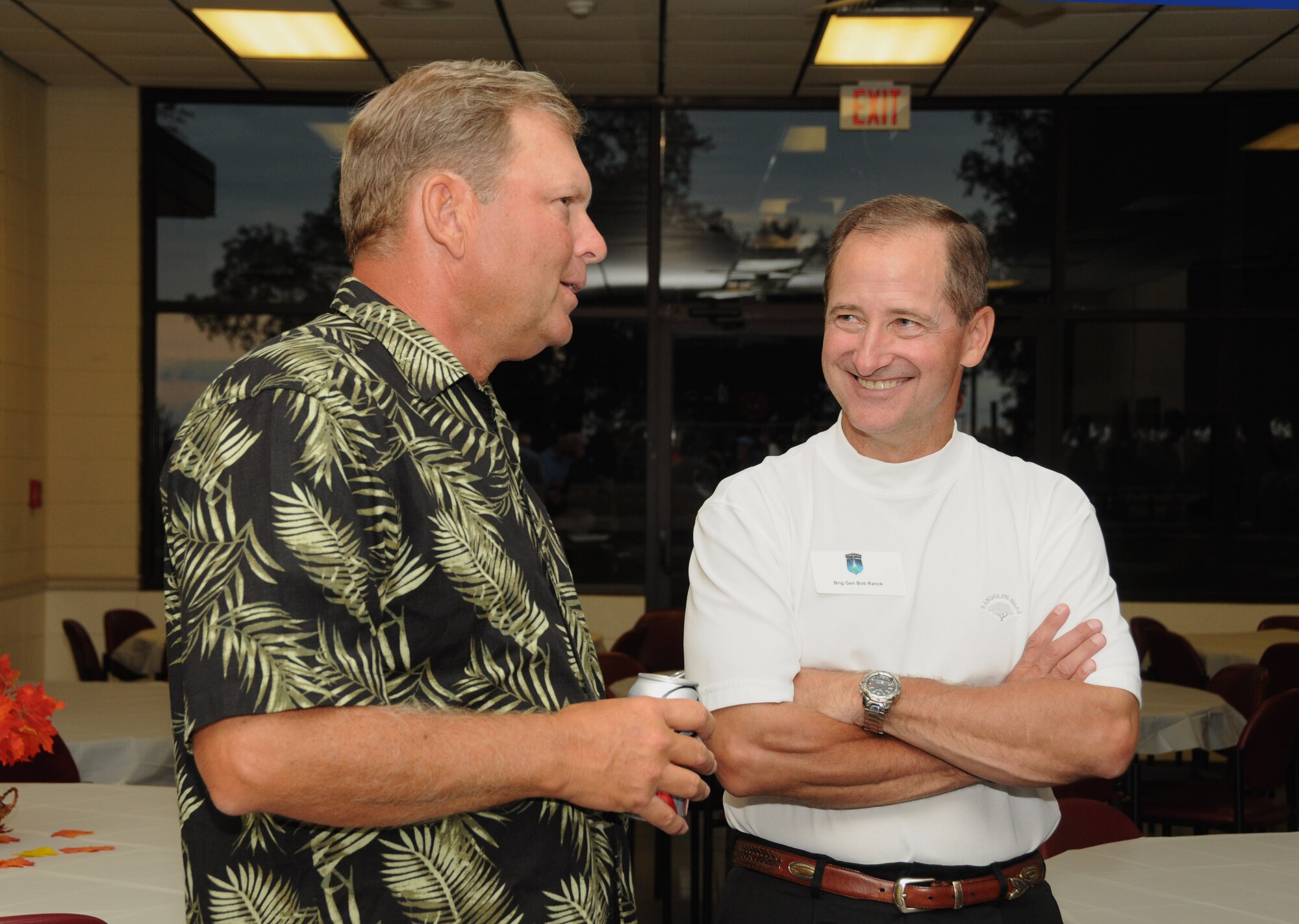 Left, retired Lt. Gen. Michael Peterson mingles with Brig. Gen. John R. “Bob” Ranck Jr., Director, Warfighter Systems Integration Directorate, Office of Warfighting Integration and Chief Information Officer, Office of the Secretary of the Air Force, the Pentagon, Washington, D.C., during a fish fry at the Marina Park during the Scope Warrior event.  The fish fry is sponsored by the Biloxi Chamber of Commerce.  Scope Warrior was held at Keesler Air Force Base, Miss., Oct. 17-21, 2011.  Scope Warrior is an annual event for Air Force senior communications leaders.  (U.S. Air Force photo by Kemberly Groue)
