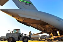 Members from the 20th Logistics Readiness Squadron aerial porters, remove 20th Operation Group cargo and equipment from a C-17 Globemaster III, Oct. 20, 2011, Shaw Air Force Base, S.C. Crewmembers aboard the C-17 from the 62nd Airlift Wing and 627th Air Base Group, McChord Field, Wash., transported Secretary of State Hillary Rodham Clinton to Tripoli, Libya, earlier that week. (U.S. Air Force photo by Airman 1st Class Neil D. Warner)