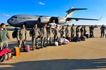 U.S. Air Force members with the 55th Fighter Squadron from Shaw unloads from a C-17 Globemaster III, Oct. 20, 2011, Shaw Air Force Base, S.C.Crewmembers aboard the C-17 from the 62nd Airlift Wing and 627th Air Base Group, McChord Field, Wash., transported Secretary of State Hillary Rodham Clinton to Tripoli, Libya, earlier that week. (U.S. Air Force photo by Airman 1st Class Neil D. Warner)