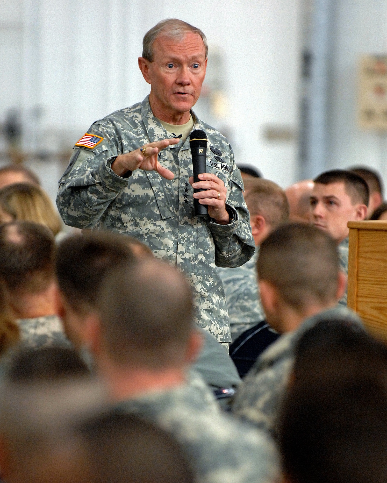 The 18th Chairman of the Joint Chiefs of Staff General Martin Dempsey addresses Soldiers, Airmen, Sailors, Marines and civilians at a town hall meeting in hanger 20 on Joint Base Elmendorf-Richardson, Alaska, Oct. 25, 2011. More than 600 military and civilian members listened to his goals and challenges for the Department of Defense. General Dempsey took question from the audience following his remarks. (U.S. Air Force photo/Staff Sgt. Zachary Wolf)