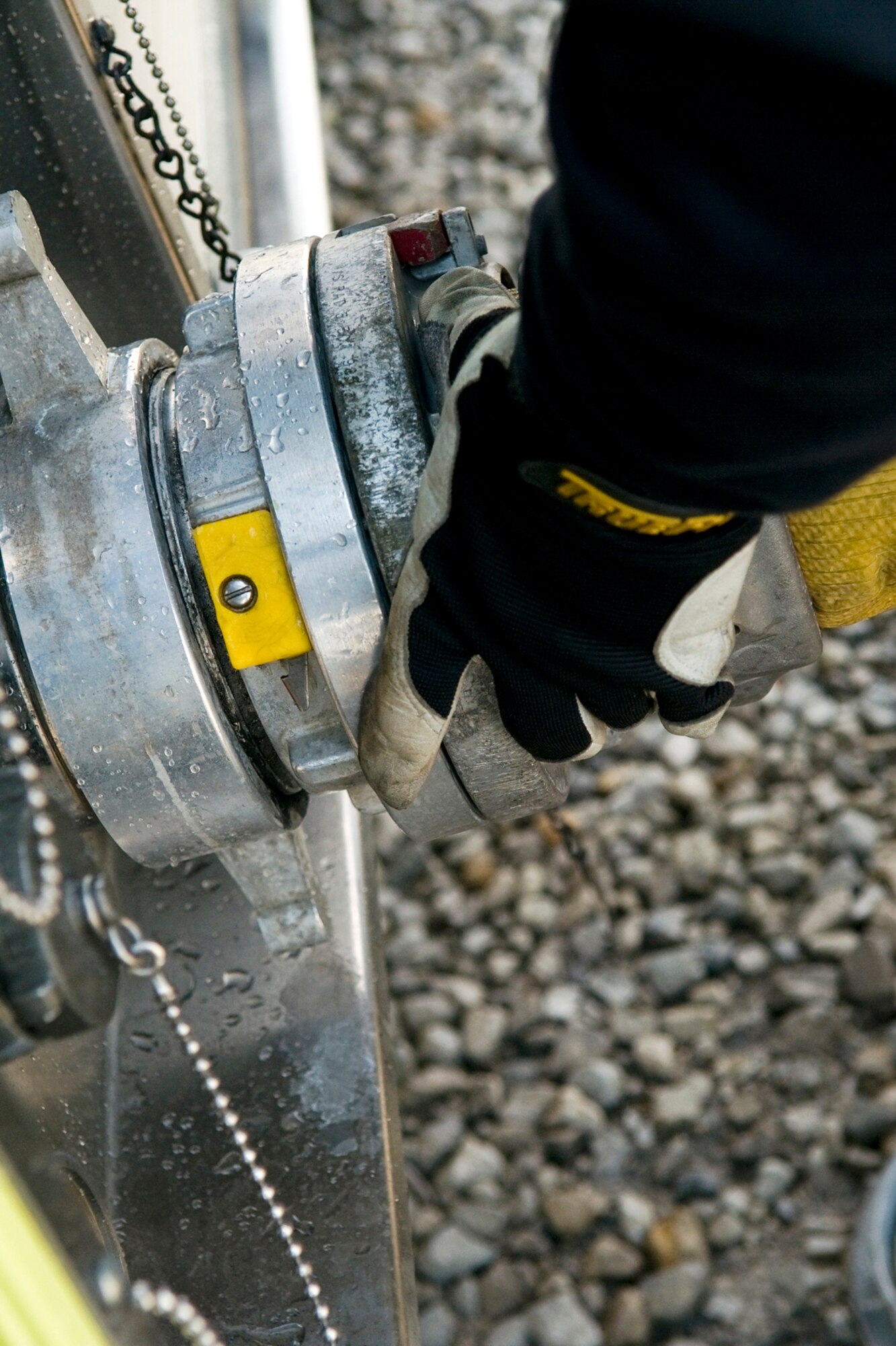 GRISSOM AIR RESERVE BASE, Ind. -- A Grissom firefighter hooks up to a hydrant to refill his fire truck with more water before heading back for more training on an aircraft fire simulator here Oct. 14. (U.S. Air Force photo/Senior Airman Jami K. Lancette)    