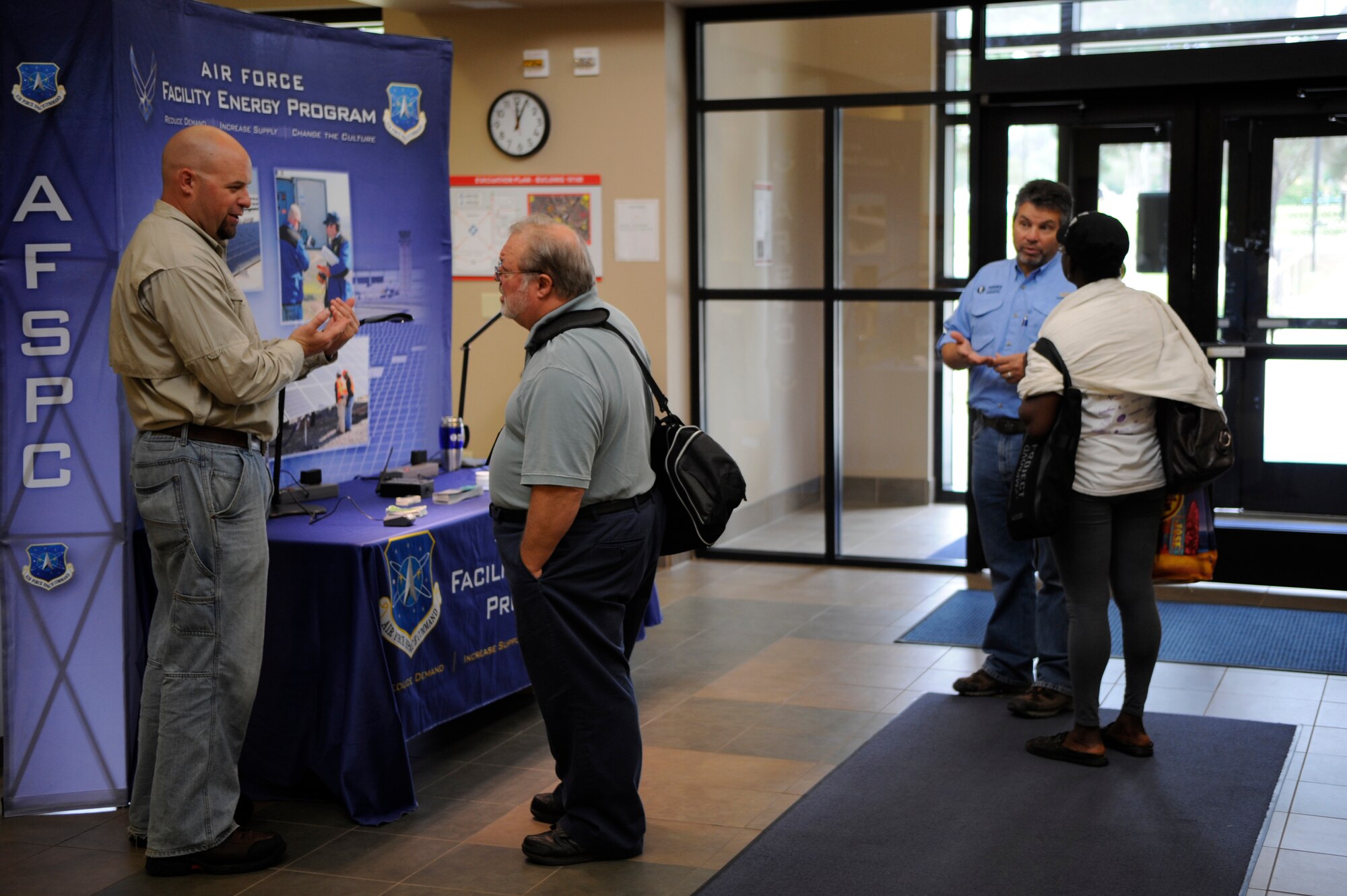 VANDENBERG AIR FORCE BASE, Calif. -- Members of the 30th Civil Engineer Squadron Energy Management Team educate base personnel on how to reduce energy consumption at the base fitness center Tuesday, Oct. 25, 2011. The team is raising awareness to lower energy consumption in support of Energy Awareness Month.  (U.S. Air Force photo/Staff Sgt. Andrew Satran) 

 
 