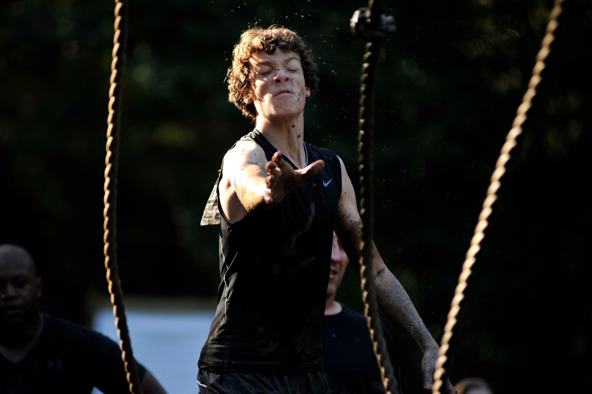 A participant of the U.S. Marine Corps Mud Run reaches out for a rope to swing across a soupy mud pit, Oct. 15, 2011, Columbia, S.C. Participants competed in four person teams in different categories: male, female, co-ed, homeland heroes, military, corporate and JROTC. (U.S. Air Force photo by Senior Airman Kenny Holston/Released)


