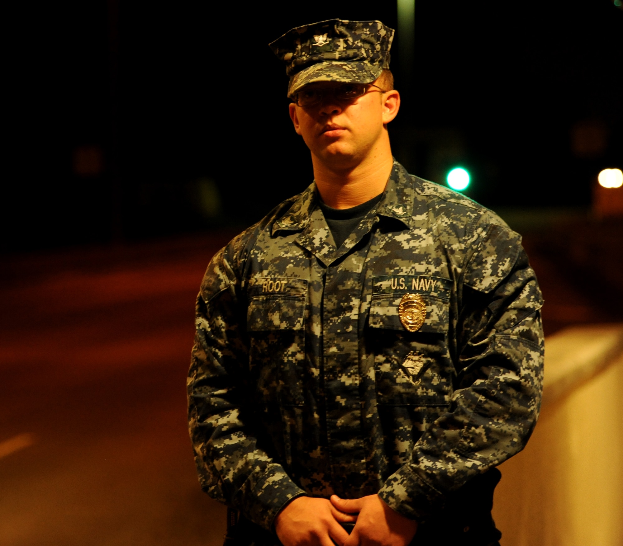 U.S. Navy Petty Officer 3rd Class Thomas Root, a master at arms attached to the 18th Security Forces Squadron, stands guard during Beverly High 12-1, a local operational readiness exercise on Kadena Air Base, Japan, Oct.26. Kadena personnel are participating in the LORE to stay prepared for real world contingencies. (U.S. Air Force photo/Airman 1st Class Jarvie Z. Wallace)
