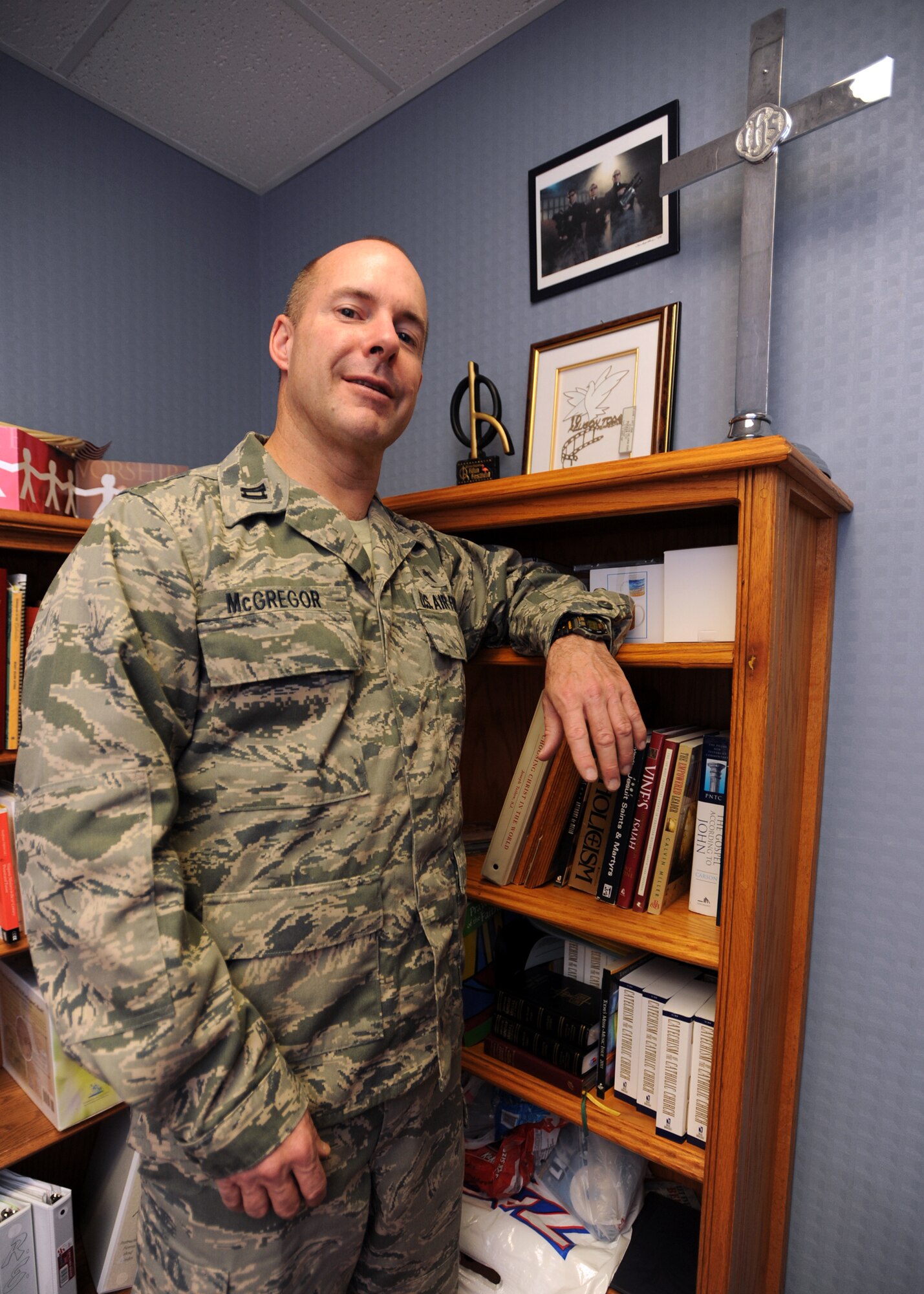 MINOT AIR FORCE BASE, N.D. -- One of the newest additions to the base chapel team is Capt. Mark McGregor, 5th Bomb Wing chaplain and former film production professor. Being a Catholic priest for more than 15 years and a professor for seven years, he said he decided to join the military because he continually noticed the burden service members and their families endured year after year. (U.S. Air Force Photo/Airman 1st Class Jose L. Hernandez)