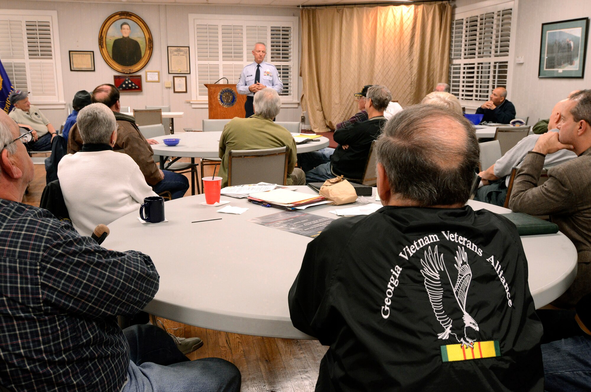 Chief Master Sgt. Wendell Peacock, Command Chief for the 94th Airlift Wing at Dobbins Air Reserve Base, speaks to members of the Georgia Vietnam Veterans Alliance in Marietta, Ga., Oct. 20. The Marietta Chapter of the alliance is dedicated to provide quality services and support to veterans to help with their self-esteem and encourage them to be self reliant.   (U.S. Air Force photo Illustration/ Brad Fallin)