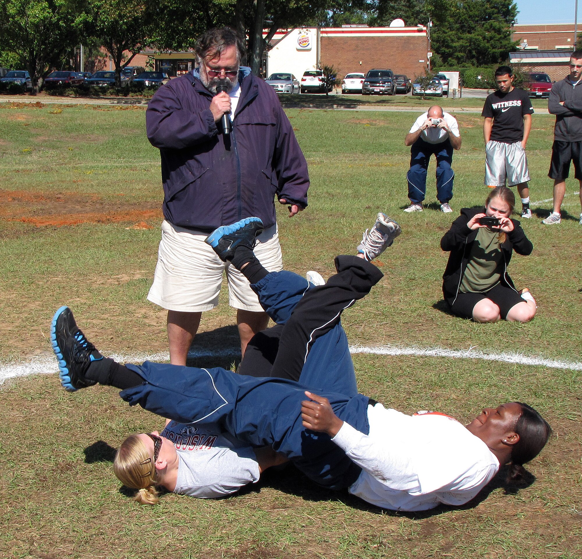 Viper Challenge participants compete in the leg wrestling portion of the challange at Shaw Air Force Base, S.C., Oct. 21, 2011. The challenge allowed people to get out of the office, mingle with those they don’t work with and have a great time getting their mind off the normal work day. (Courtesy of 20th Force Support Squadron/Released) 