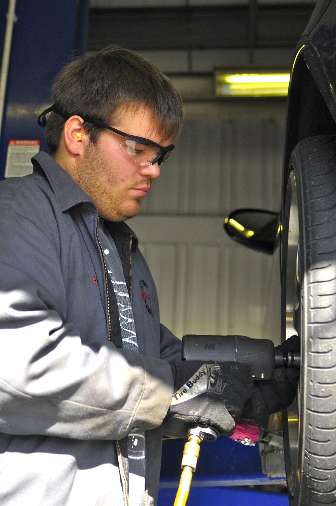 Steven Sabocz, an automotive worker for the Ramstein Auto Hobby Shop, removes a summer tires from a vehicle to replace with all-season tires in the Ramstein Auto Hobby Shop Oct. 26, 2011 on Ramstein Air Base, Germany. For more information about winter weather driving safety call 480-SAFE. To get and keep your vehicle ready for the winter, make an appointment at your local auto hobby shop. For current updates on road conditions during inclement weather and other weather information resources go to www.ramstein.af.mil/weatherinfo.asp or call 480-COLD.  (U.S. Air Force photo/Staff Sgt. Travis Edwards)