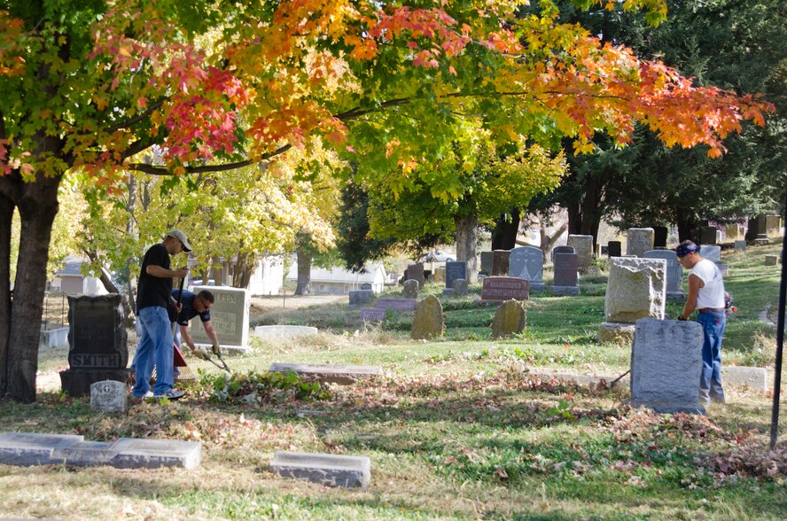 Members of the 139th Airlift Wing, Missouri Air National Guard, volunteer with lawn maintenance at Mount Mora Cemetery, St. Joseph, Mo., Oct. 25, 2011.  The graveyard is where the Wing’s first commander, Col. John B. Logan, is buried. (U.S. Air Force photo by Staff Sgt. Michael Crane/Missouri Air National Guard)