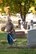 Col. Ralph Schwader, 139th Airlift Wing vice commander, Missouri Air National Guard, cuts weeds at Mount Mora Cemetery in St. Joseph, Mo., Oct. 25, 2011. Members of the 139th AW volunteered with lawn maintenance of the graveyard where the Wing’s first commander, Col. John B. Logan, is buried. (U.S. Air Force photo by Staff Sgt. Michael Crane/Missouri Air National Guard)