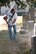 Col. Michael Pankau, 139th Airlift Wing commander, Missouri Air National Guard, cuts weeds at Mount Mora Cemetery in St. Joseph, Mo., Oct. 25, 2011. Members of the 139th AW volunteered with lawn maintenance of the graveyard where the Wing’s first commander, Col. John B. Logan, is buried. (U.S. Air Force photo by Staff Sgt. Michael Crane/Missouri Air National Guard)