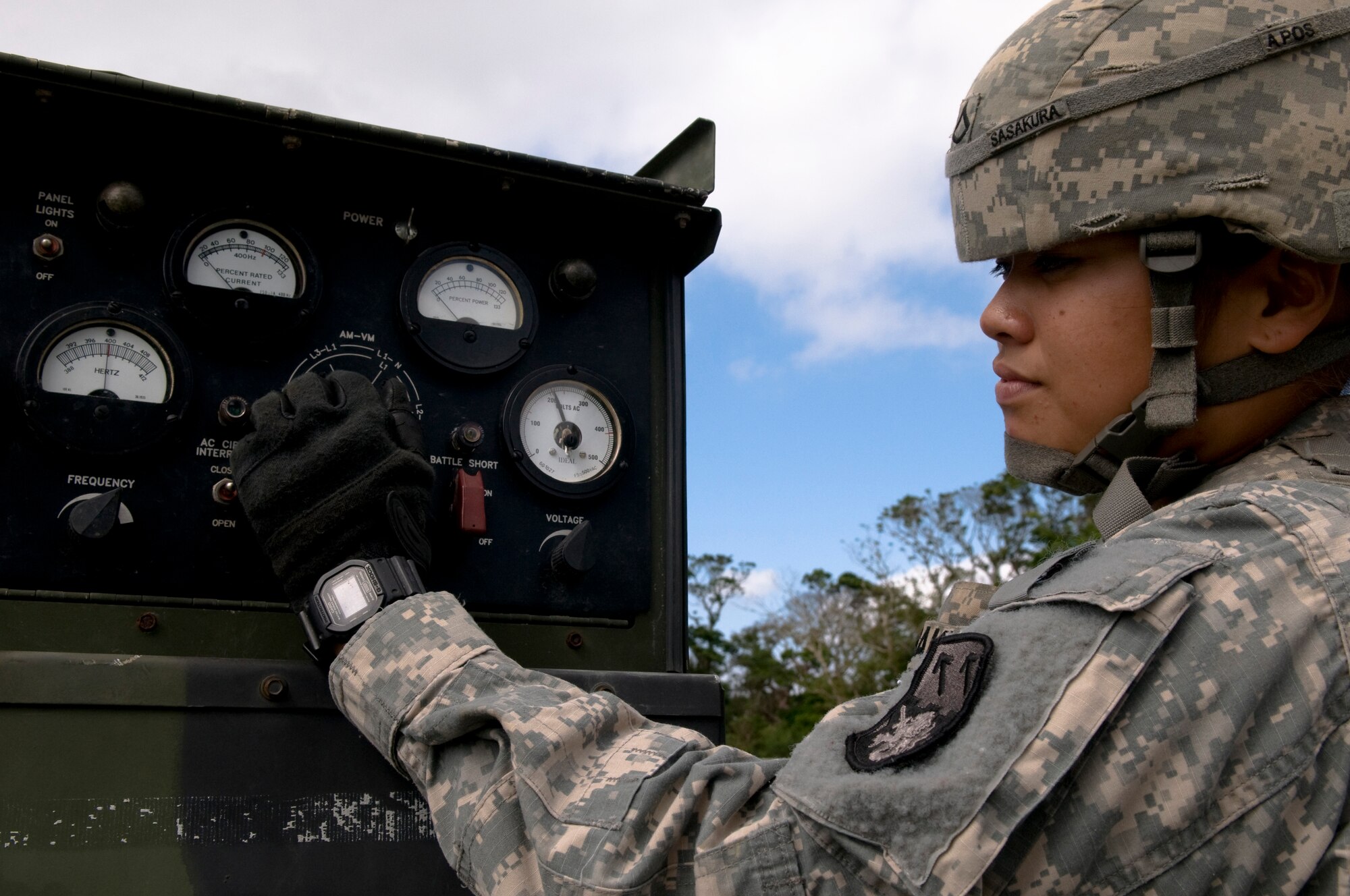 U.S. Army Private 1st Class Danica Sasakura, 1-1 Air Defense Artillery, Charley Battery Patriot Missile operator, adjusts a Patriot Missile launcher's settings during a field training exercise on Kadena Air Base, Japan, Oct. 26. The unit stationed on Kadena conducts training two to three times a year to ensure the safety of Japan and the other U.S. forces stationed here. (U.S. Air Force photo/Airman 1st Class Maeson L. Elleman/released)