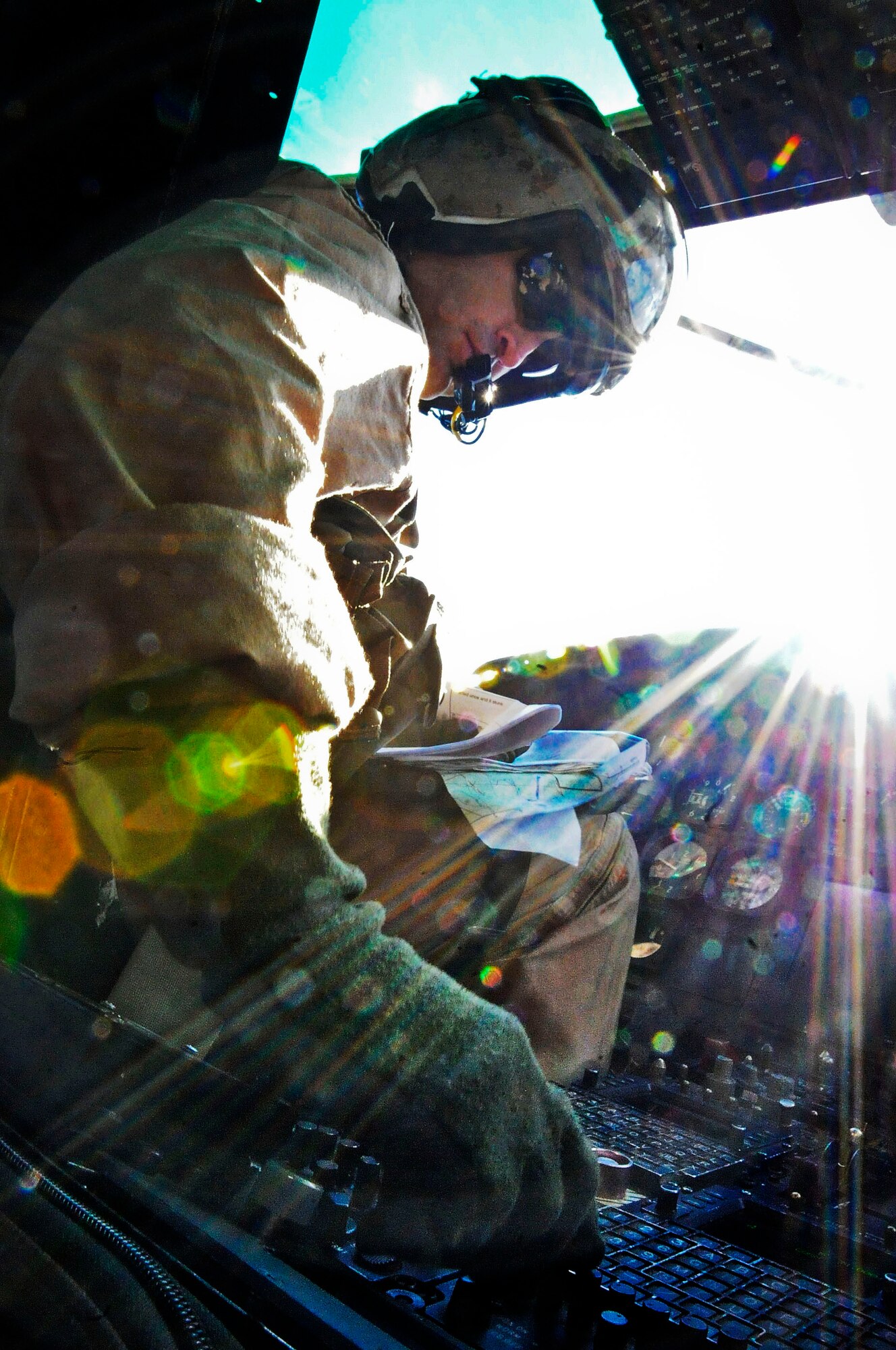 Lt. Col Rob Bates, a UH-1N Iroquois helicopter pilot with the Marine Light Attack Helicopter Squadron 773, adjusts aerial instruments during a Joint Tactical Recovery of Aircraft and Personnel exercise Oct. 15 here. The Joint TRAP exercise tested the Reservists’ ability to recover downed aircrew members from behind enemy lines. Crew chiefs aboard this helicopter provided cover fire so the downed Marine aircrews could be rescued. Bates is a Dover, Del. native. (U.S. Air Force photo by Airman 1st Class Dennis L. Sloan/Released) 