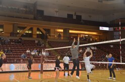 Airmen from Joint Base Charleston participate in a six on six mini-volleyball match during halftime at the College of Charleston Women's Volleyball Military Appreciation Night, Oct. 21, at The College of Charleston's TD Arena in downtown Charleston.The women's volleyball team hosted Military Appreciation Night in honor of all branches of service in order to say thank you to our many military heroes. (U.S. Air Force photo/2nd Lt. Susan Carlson)
