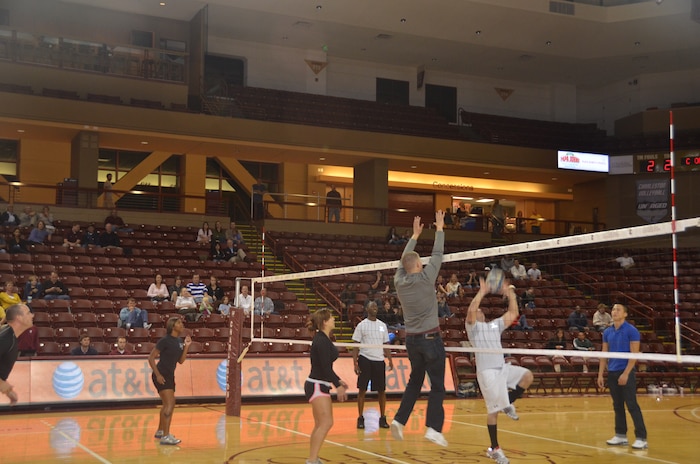 Airmen from Joint Base Charleston participate in a six on six mini-volleyball match during halftime at the College of Charleston Women's Volleyball Military Appreciation Night, Oct. 21, at The College of Charleston's TD Arena in downtown Charleston.The women's volleyball team hosted Military Appreciation Night in honor of all branches of service in order to say thank you to our many military heroes. (U.S. Air Force photo/2nd Lt. Susan Carlson)
