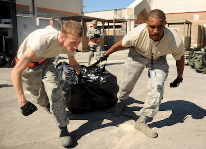 Senior Airman Chris Lindsay and Staff Sgt. Stephen Kohn, pull a tent into place during an Operational Readiness Exercise in Gulfport, Miss. Oct. 24.The ORE is in preparation for the command's upcoming Operational Readiness Inspection which evaluates Airmen's mission readiness in preparation for real world deployments. Lindsay and Kohn are both from the 628th Security Forces Squadron. (U.S. Air Force photo/Staff Sgt. Chad Trujillo)
Lindsay and 
