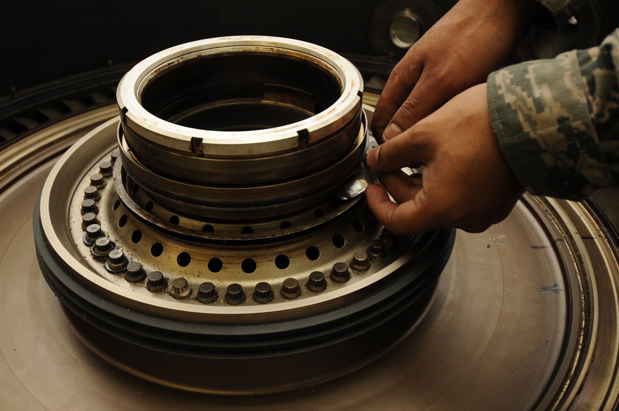 SPANGDAHLEM AIR BASE, Germany -- Senior Airman Juan Serrano, 52nd Component Maintenance Squadron aerospace propulsion mechanic, assembles parts of an F-16 Fighting Falcon engine during Aerospace Propulsion Intermediate Maintenance training here Oct. 25. Airmen learn how to build up the core of an engine during the class, which keeps them proficient in their primary duties of maintaining engines. (U.S. Air Force photo/Airman 1st Class Brittney Frees)