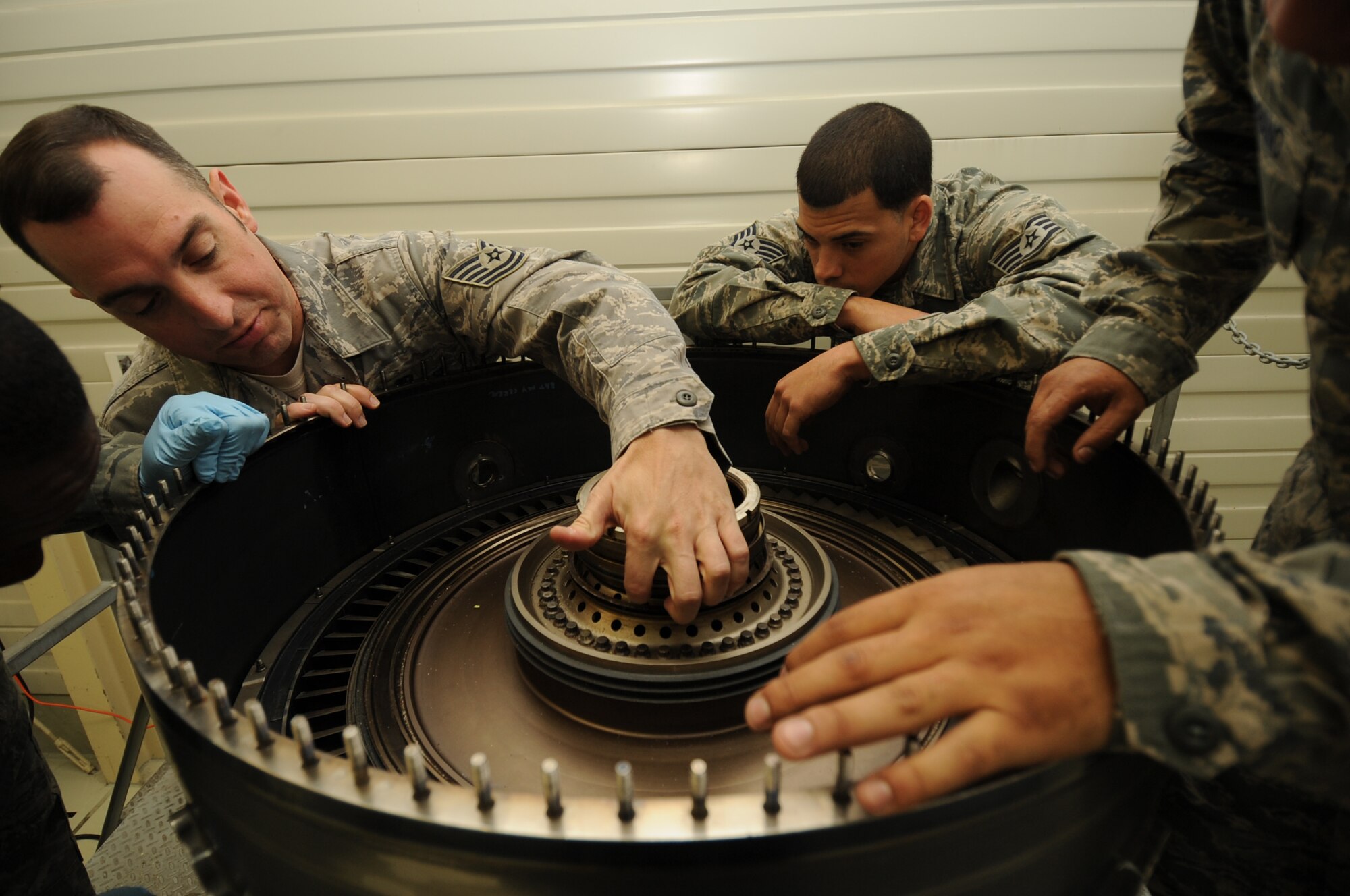SPANGDAHLEM AIR BASE, Germany -- Tech. Sgt. Steven Bousquet, 372nd Training Squadron propulsion instructor, shows Airmen in his class the different parts of an F-16 Fighting Falcon engine during Aerospace Propulsion Intermediate Maintenance training here Oct. 25. Airmen learn how to build up the core of an engine during the class, which keeps them proficient in their primary duties of maintaining engines. (U.S. Air Force photo/Airman 1st Class Brittney Frees)