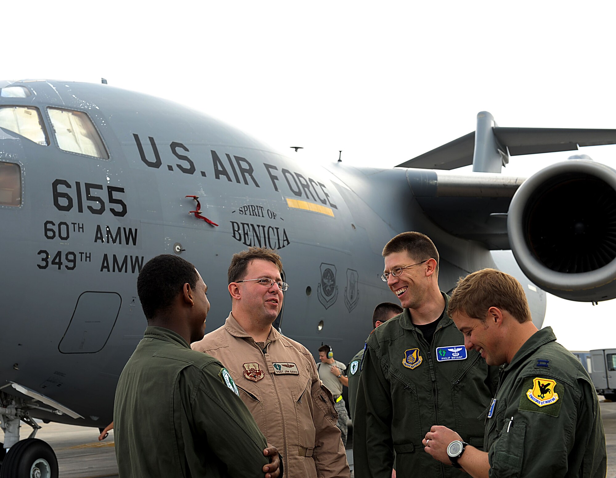 U.S. Air Force Tech. Sgt. James Davis, 33rd Rescue Squadron flight engineer, talks with his co-workers after returning home to Kadena Air Base, Japan, Oct. 26. Davis is returning home to Kadena from Travis Air Force Base, Calif. after spending several months in rehabilitation for a gunshot wound he acquired while serving in Afghanistan this spring. (U.S. Air Force photo/Airman 1st Class Brooke P. Beers/Released)