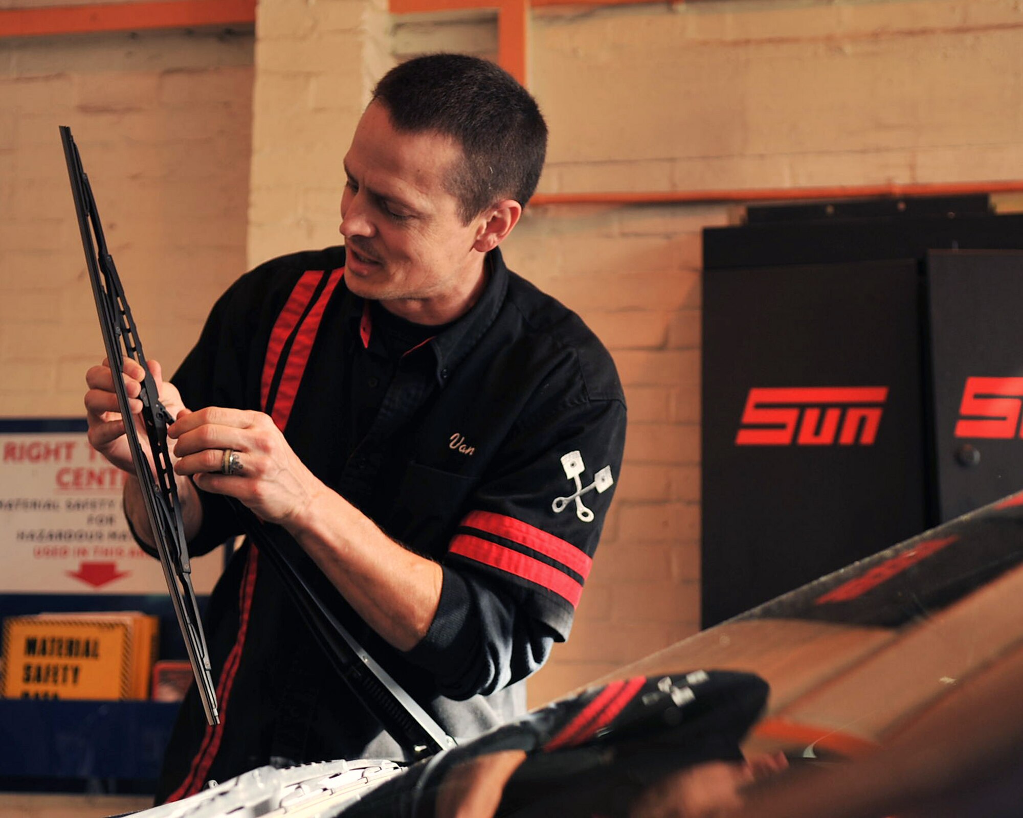 RAF MILDENHALL, England – Van Lewis, 100th Force Support Squadron Auto Hobby Complex mechanic, inspects the windshield wipers of a car here Oct. 25, 2011. Ensuring windshield wipers are in proper working order is extremely important before driving during the winter months. (U.S. Air Force photo/Senior Airman Jerilyn Quintanilla) 