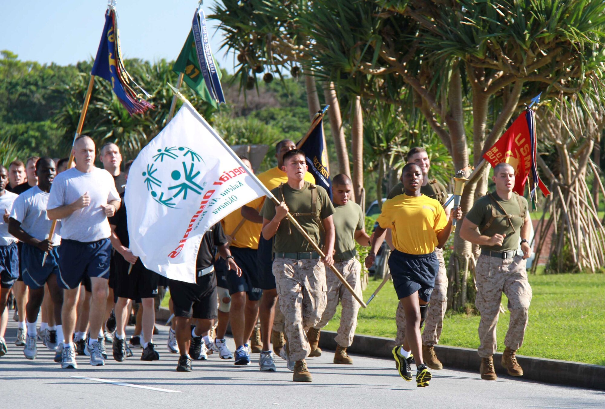 More than 100 Soldiers, Airmen, Marines and Sailors joined together representing U.S. law enforcement agencies across the island Oct. 22 to participate in the annual Special Olympics Torch Run on Kadena Air Base, Japan. Each service carried the torch from their perspective base on Okinawa to the security forces operations office on Kadena where they joined together. (U.S. Army photo/Chip Steitz/released) 
