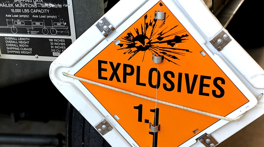 An explosives sign on a 18th Munitions Squadron trailer warns people driving too closely to keep their distance. During LOREs, the MUNS Airmen practice building bombs in large quantities, only to take them apart and rebuild them again.  (U.S. Air Force photo/ Airman 1st Class Brooke P. Beers/released)
