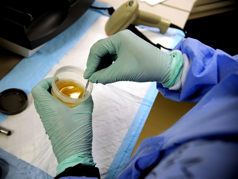 U.S. Air Force Senior Airman Taniah Otis, 18th Medical Support Squadron laboratory technician, prepares a urine sample for analysis Oct. 25 on Kadena Air Base, Japan. This specific test checks protein and pH levels as well as other specified categories to help ensure the patient is healthy. (U.S. Air Force photo/Staff Sgt. Christopher Hummel/released)