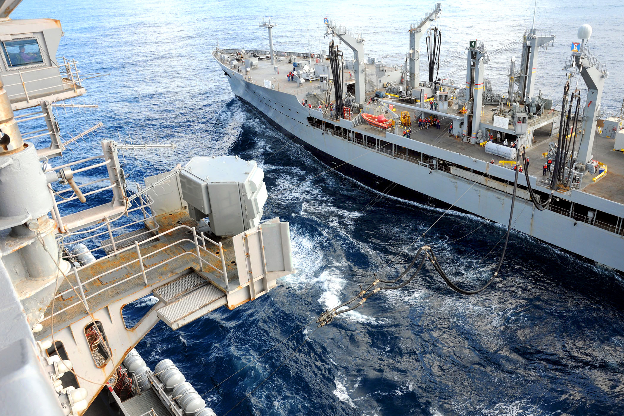 U.S. Navy sailors aboard the fleet replenishment oiler USNS Yukon