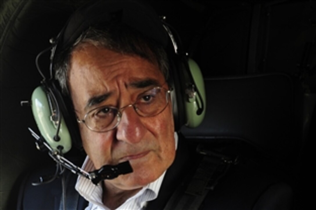 U.S. Defense Secretary Leon E. Panetta travels aboard an Army HH-60 Black Hawk helicopter on his way to visit sailors stationed aboard the USS Blue Ridge on Yokosuka Naval Base, Japan, Oct. 26, 2011.