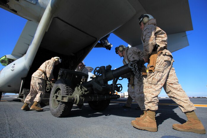 USS IWO JIMA (LHD 7) – Marines with 3rd Battalion, 10th Marine Regiment, attached to the 24th Marine Expeditionary Unit’s Battalion Landing Team, practice loading an Internally Transportable Vehicle (ITV) along with a 120 mm Towed Rifled Mortar system, commonly called the Expeditionary Fire Support System (EFSS) onto an MV-22 Osprey aboard the amphibious assault ship USS Iwo Jima Oct. 26, 2011.  The Marines conducted the training to become familiar with loading the EFSS for future operations where they will fly the vehicle and mortar off the ship using the Osprey to conduct firing exercises ashore and prepare for deployment.  This training took place as part of the Amphibious Squadron 8 (PHIBRON 8)/ 24th MEU Integration Exercise, known as PMINT.  PMINT will take place Oct. 24 to Nov. 3 and is focused on building the Navy-Marine Team and establishing the working relationships and practices necessary to conduct operations from the sea. (Official USMC Photo by: Lance Cpl Michael J. Petersheim/ Released)