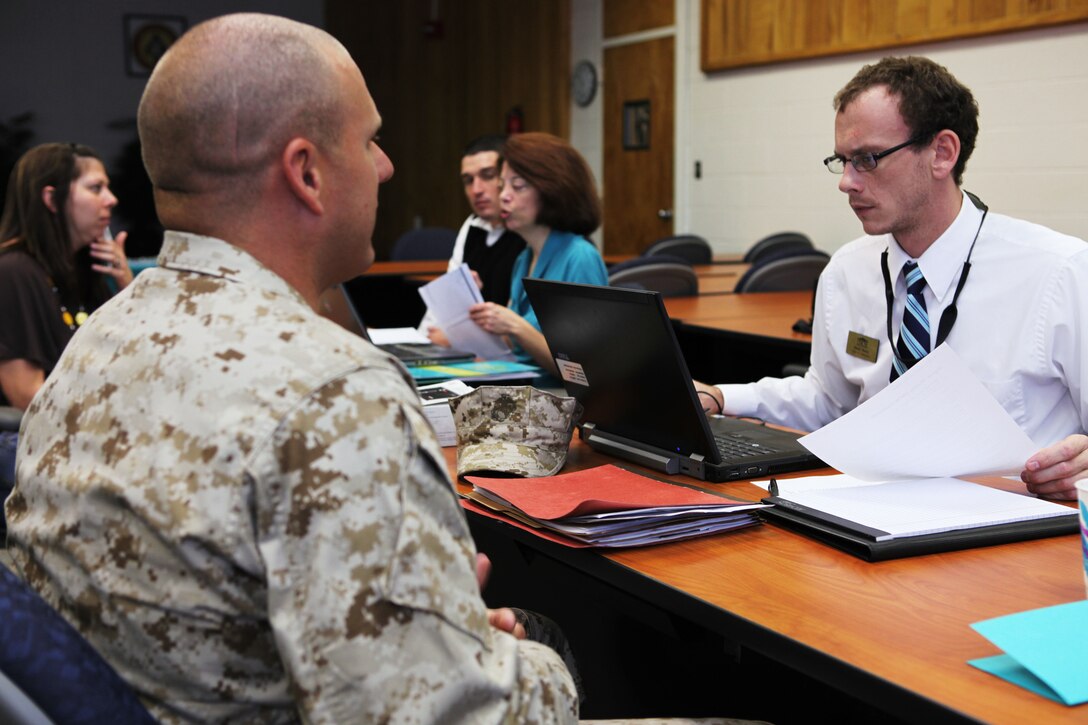 A service member consults one of the UNCW Onslow Extension Site personnel with questions concerning his application to the school at an open house held at the John A. Lejeune Education Center aboard Marine Corps Base Camp Lejeune, Oc.t. 27.