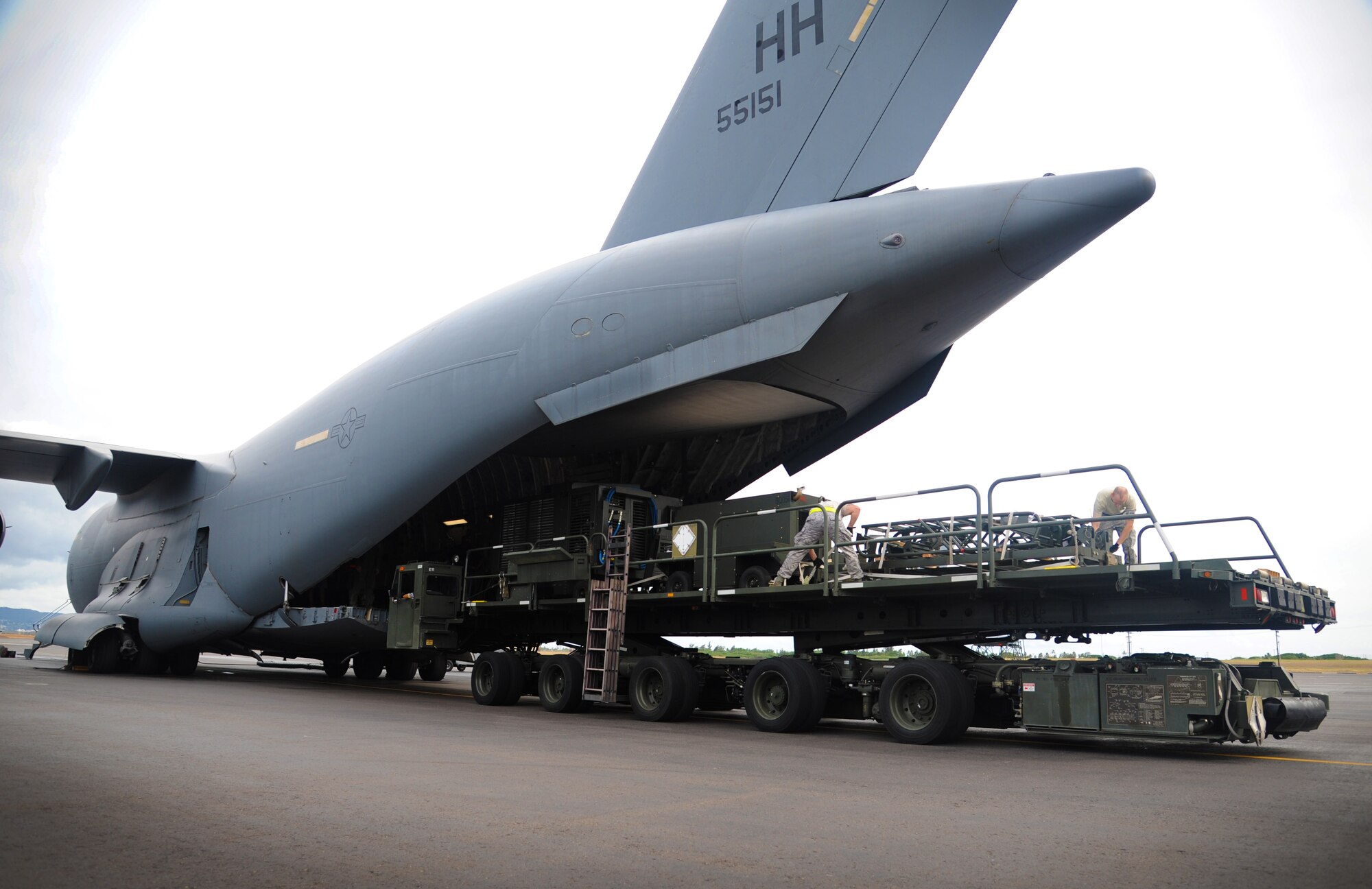 Airmen help off load cargo from a C-17 Globemaster III on to a k-loader on Joint Base Pearl Harbor-Hickam, Hawaii, Oct. 27. The cargo off loaded was part of an Operational Readiness Exercise held to ensure the Airmen and agencies are ready to support the mission and ensure seamless integration of installation support into the 15th Wing's combat mission execution.(U.S. Air Force photo/Senior Airman Lauren Main)