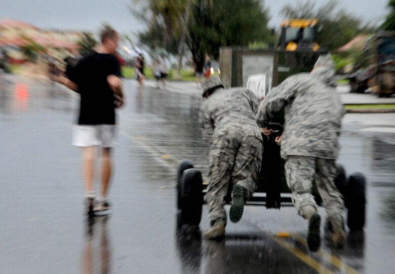 ANDERSEN AIR FORCE BASE, Guam—Members of the 36th Contingency Response Group push a generator during the group’s warrior challenge here, Oct. 21. Events during the challenge tested the 36 CRG personnel’s speed, strength and team work. (U.S. Air Force photo by Senior Airman Benjamin Wiseman/Released)