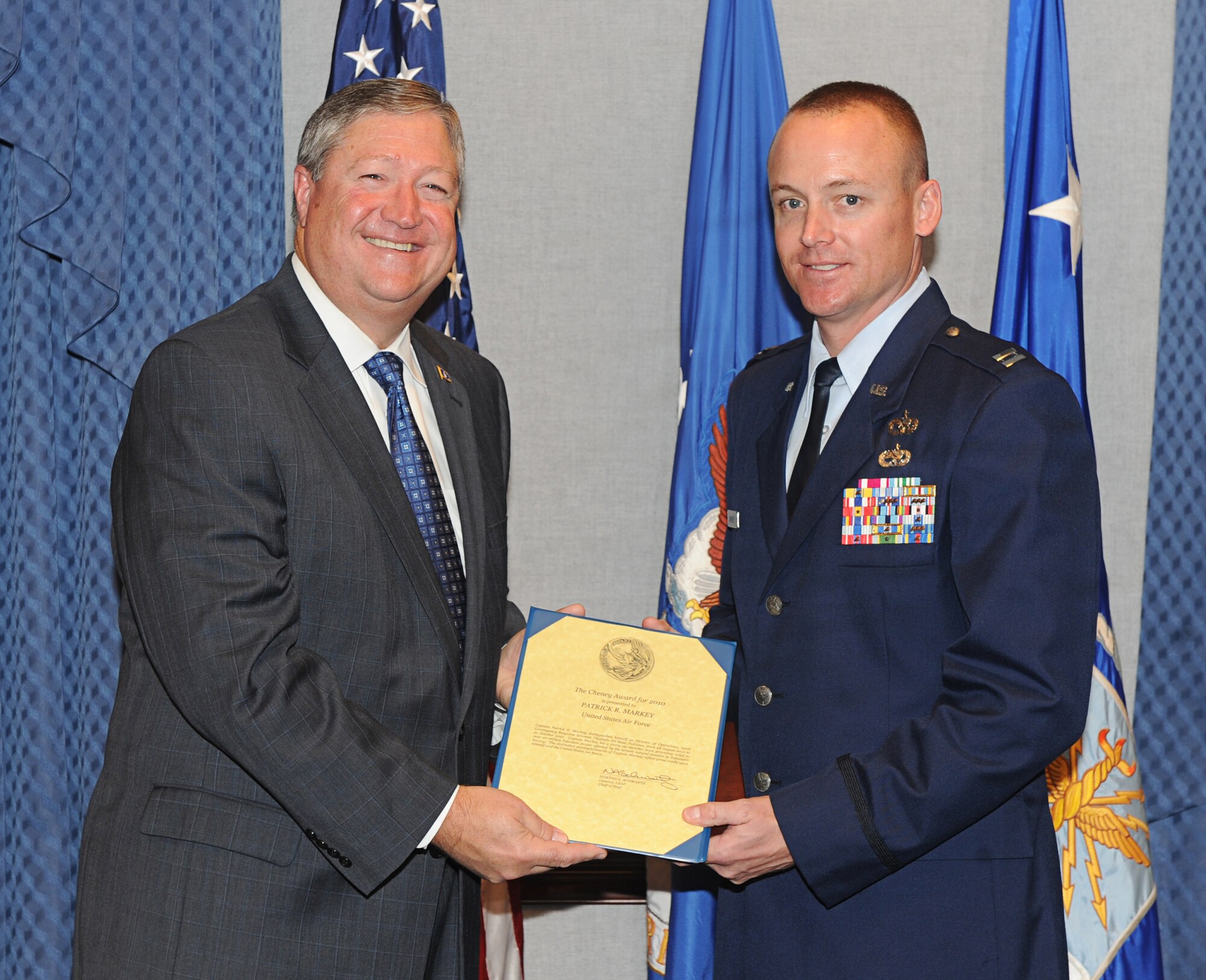 Secretary of the Air Force Michael Donley presents the Lt. William
Cheney Award to Capt. Patrick R. Markey during a ceremony at the Pentagon
Oct. 27, 2011. (U.S. Air Force Photo/Andy Morataya)