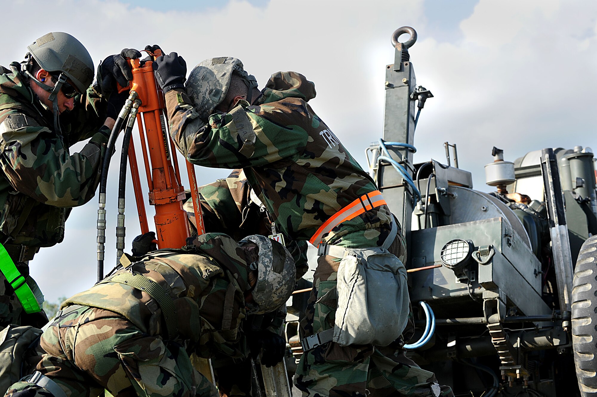 Airmen from the 18th Civil Engineer Squadron anchor down a mobile aircraft anchoring system during a local operational readiness exercise Beverly High 12-1 on Kadena Air Base, Japan, Oct. 27. The squadron is able to anchor a MAAS down to any surface. (U.S. Air Force photo/Airman 1st Class Brooke P. Beers/Released)