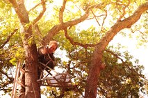 HEAD HUNTER - Curtis Hahn tells his story about falling out of tree stand  and to land himself in a coma. (photo by  Tech. Sgt. Samuel Bendet)