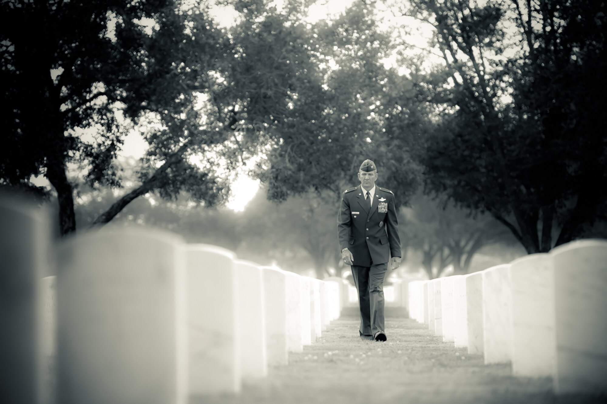 A DECADE SINCE 9/11 - Col. Creig A. Rice, AETC director of safety, visits the Fort Sam Houston National Cemetery in San Antonio. Rice recently served in the air advisor mission in Afghanistan. He is stressing resiliency in dealing with the stresses of war to help combat suicides and stress-related mishaps. (photo by Tech. Sgt. Samuel Bendet)