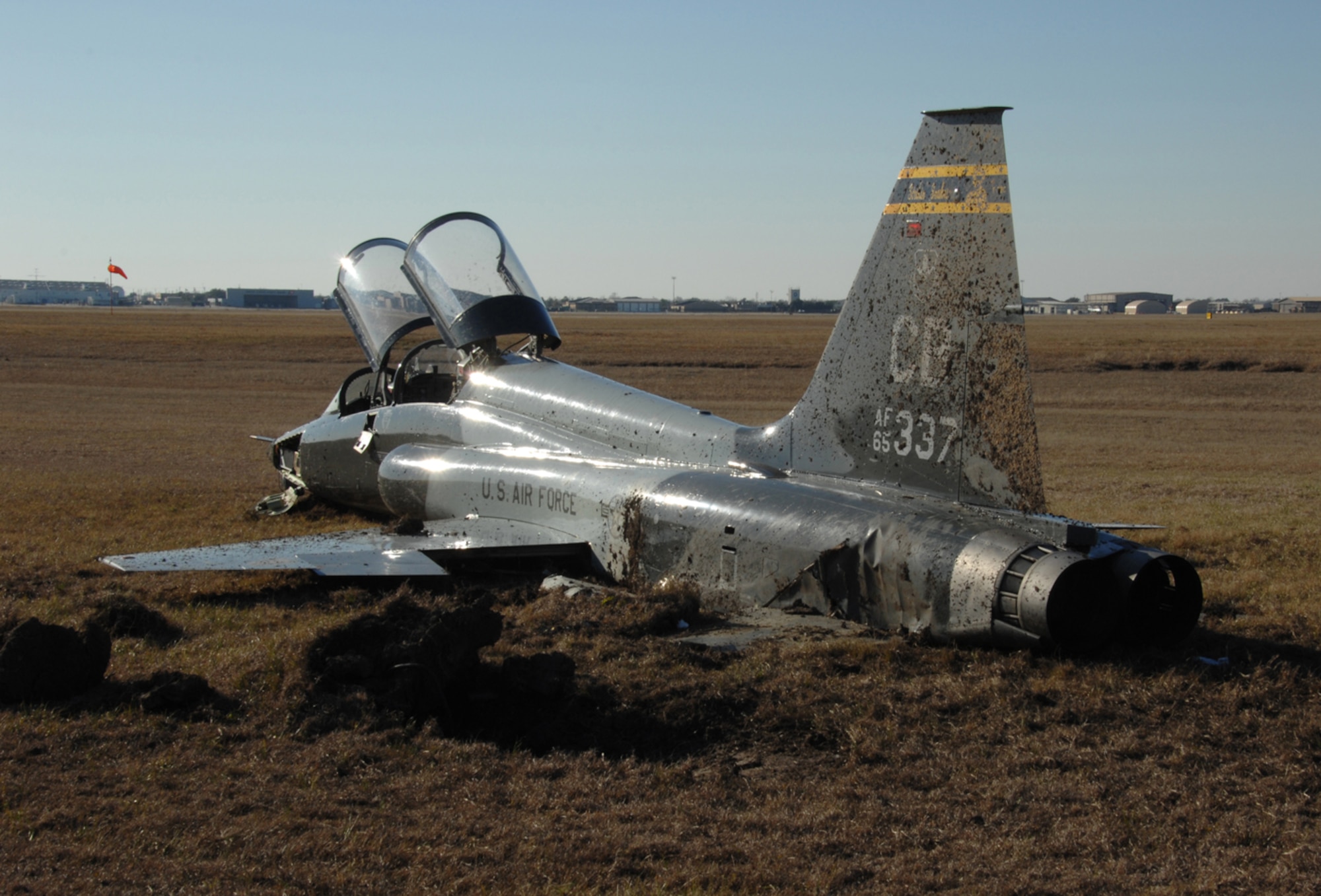 T-38 CRASH PROBE - When he became disoriented and misjudged the runway, a pilot with the 14th Flying Training Wing at Columbus AFB, Miss., crashed a T-38 Talon at Ellington Field, Texas. The crash landing caused $2.1 million in damage to the landing gear, engines, right wing and tail section of the twin-engine supersonic jet. (photo by Master Sgt. Dale Hanson III)