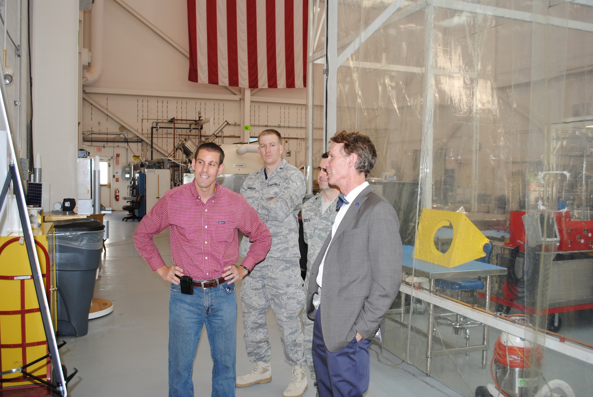 Mark Scherbarth, program manager, Demonstration and Science Experiments satellite, Air Force Research Laboratory’s Space Vehicles Directorate, left, explains the various parts of the spacecraft to Bill Nye, right.

Photo by Brian Brackens