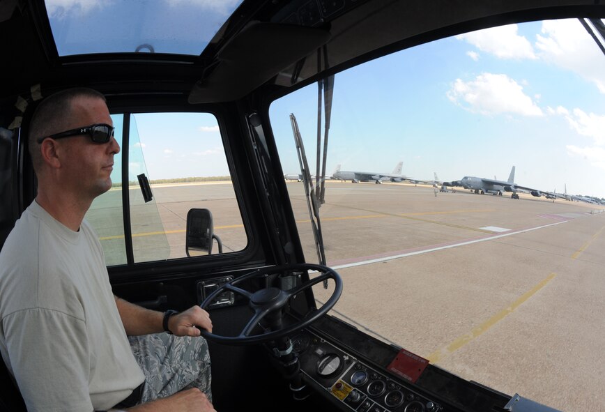 Tech. Sgt. Christian Davis, 2nd Aircraft Maintenance Squadron, drives a tow truck on the flight-line on Barksdale Air Force Base, La., Oct. 25. The tow truck was brought to a hangar where a B-52H Stratofortress was waiting to be moved for maintenance. (U.S. Air Force photo/Airman 1st Class Micaiah Anthony)(RELEASED)