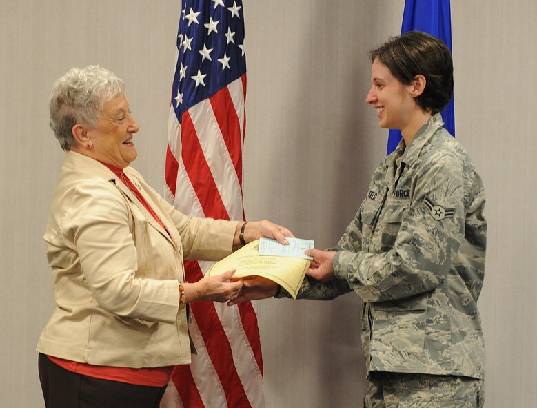 Helen Black, El Dorado Resort and Casino, presents an award to Airman 1st Class Katelyn Field, 26th Operational Weather Squadron weather forecaster, during the September Airman of the Month presentation on Barksdale Air Force Base, La., Oct. 25. Field was selected from more than 2,000 active duty Airmen assigned to Barksdale. (U.S. Air Force photo/Airman 1st Class Micaiah Anthony)(RELEASED)