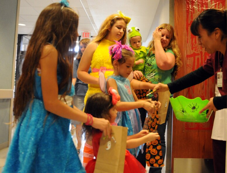 LAUGHLIN AIR FORCE BASE, TEXAS — Laughlin children line up for candy in the 47th Medical Group building. The Family Child Care Center put on the event to give children an opportunity to show off their costumes and receive candy early. (U.S. Air Force photo/2nd Lt. James Ramirez)