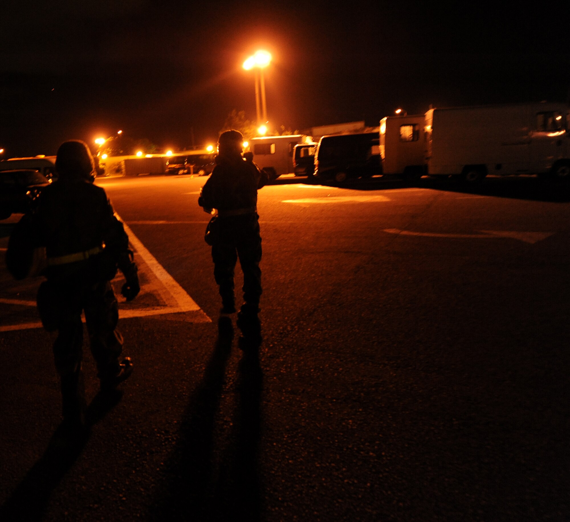 U.S. Air Force Senior Airman Christopher Duenas and Airman 1st Class Jose Soto, both 18th Logistics Readiness Squadron vehicle operators, conduct a post attack reconnaissance sweep during Beverly High 12-1, a local operational readiness exercise, on Kadena Air Base, Japan, Oct. 27. During the LORE, Airmen are expected to perform and operate in numerous scenarios from minor on-the-job injuries, to bomb threats, chemical and aerial attacks. (U.S. Air Force photo/ Airman 1st Class Jarvie Z. Wallace/released